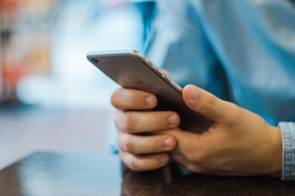 Person using a WhatsApp business chat on a smartphone, reflecting WhatsApp AI pricing 2026 changes