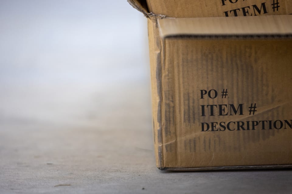 E-commerce return box illustrating deterministic AI vs LLM fraud detection for online retailers