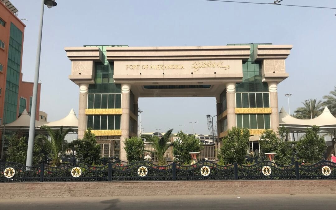 Main gateway of the Port of Alexandria with bilingual Arabic and English signage, representing regional customs and freight forwarding for GCC businesses